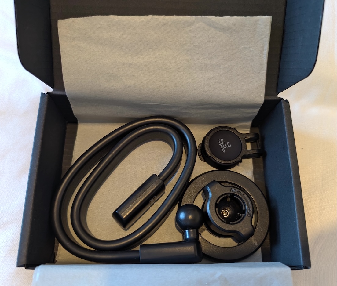 ScoreBot accessories neatly packed in a small black shipping box